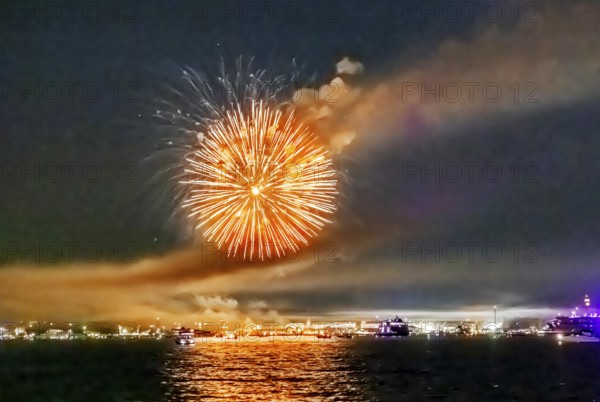 Lake Night Festival Constance. Water fireworks over the German shore and the neighbouring Swiss town of Kreuzlingen. View of the fireworks from Lake Constance. Constance, Baden-Württemberg, Germany
