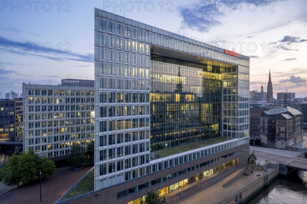 Aerial view of the Spiegel building at Ericusspitze in Hamburg's HafenCity in the Brooktorkai neighbourhood at blue hour, Hamburg, Germany