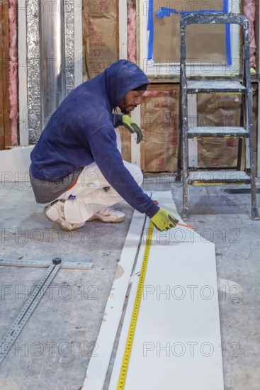 Detroit, Michigan - Workers remodel a house in the Morningside neighborhood that had been vacant for many years. Detroit lost nearly two-thirds of its residents from 1950 to 2020 but has been growing modestly in recent years