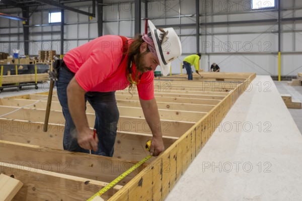 Romulus, Michigan - Workers build apartments in Ginosko Modular 's factory using modular construction methods. The units will be assembled into an apartment building in Detroit for low to moderate income households