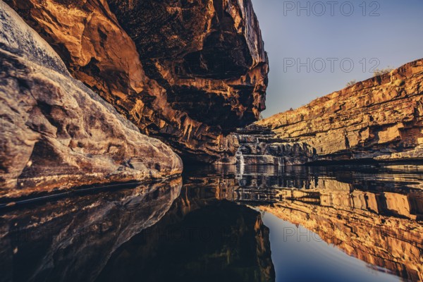 Bell Gorge waterfall, a body of water in north-west Australia in the Kimberley. Sunrise in the outback, Australia