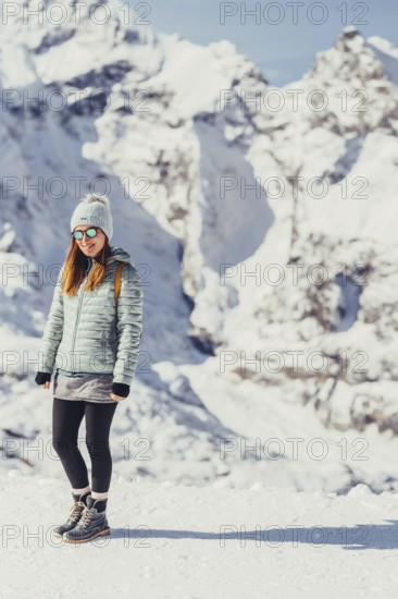 Woman in wintry surroundings in the Engadine in Switzerland