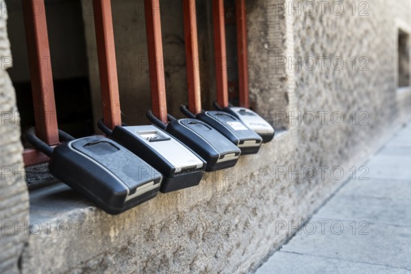 Key boxes on a grille of a basement window for flat flats in the city centre of Bratislava, Slovakia