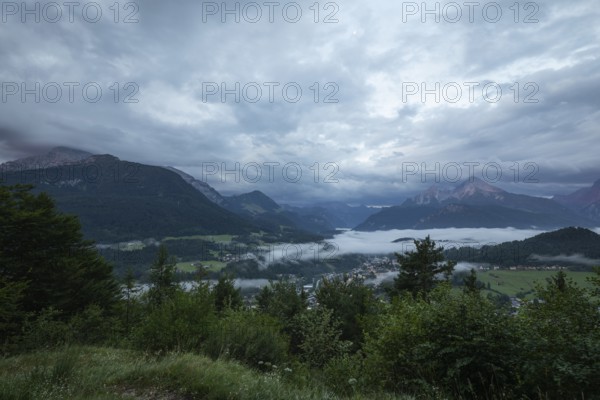Marxenhöhe near Berchtesgaden with Watzmann view in the morning mist after the rain