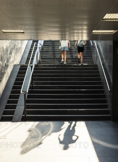 Pedestrians walking up a staircase in the summer heat, Capital of Culture 2026, Trencín, Slovakia