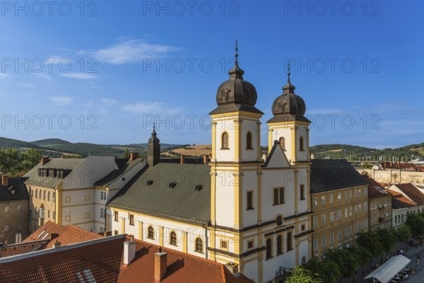 View from the city tower of the Piarist Church of St Francis Xavier and the old town in the evening light, Capital of Culture 2026, Trencín, Slovakia