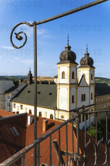 View from the city tower of the Piarist Church of St Francis Xavier and the old town in the evening light, Capital of Culture 2026, Trencín, Slovakia