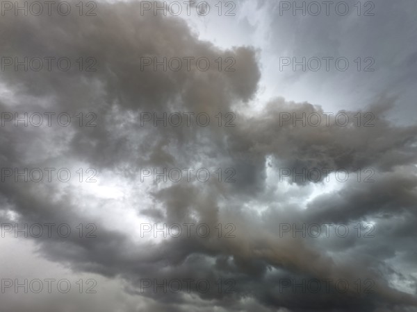 Dark discoloured storm clouds Cloud roll above grey clouds Rain clouds herald thunderstorms, Germany
