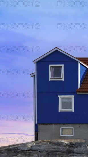 Typical architecture of Greenland Ilulissat with colored houses located near fjords and icebergs