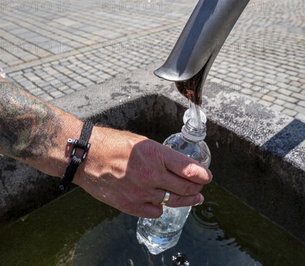 Drinking water supply at a public well, Bavaria, Germany