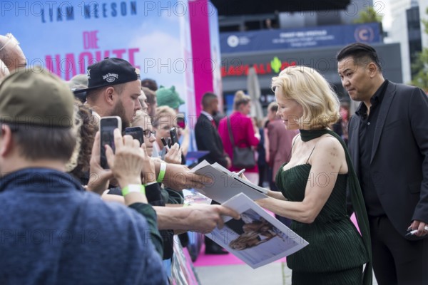Pamela Anderson signs autographs in front of the film premiere of The Naked Gun at UCI Luxe East Side Gallery, Berlin, 24.07.2025