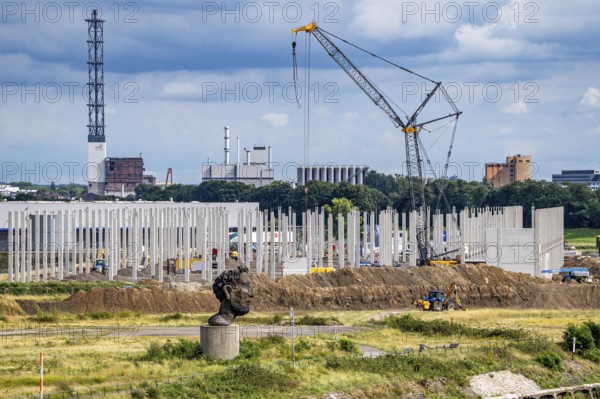 Construction of a new logistics hall on the Mercatroinsel, Hall 2, next to an existing hall, approx. 25, 000 square metres in size, in Duisburg-Ruhrort, shell construction, sculpture The Echo of Poseidon on the Rhine, North Rhine-Westphalia, Germany