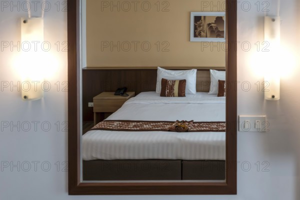 Symbol photo hotel room mirror bed