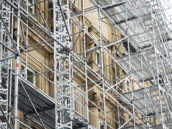 Scaffolded façade of the district court with metal platforms and stairs in Wuppertal, Germany
