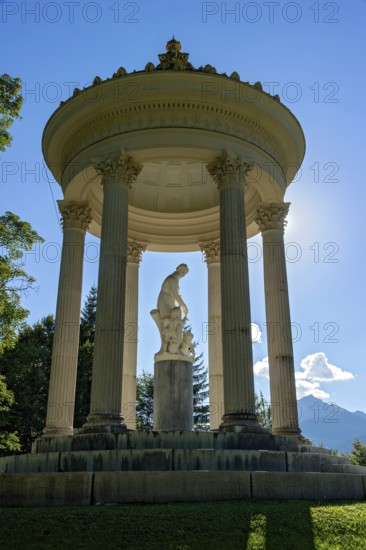 Statue of Venus with Cupid in the Temple of Venus above the terraced gardens, backlight, long shadows, blue sky, park of Linderhof Castle, UNESCO World Heritage Site, Ettal, Unterammergau, Garmisch-Partenkirchen, Upper Bavaria, Bavaria, Germany