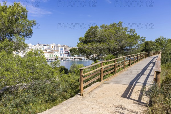 Portocolom fishing village on Majorca with boats and colourful houses Holiday by the sea in Portocolom, Spain