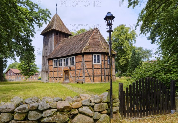 The village church of Karrenzin is a half-timbered church dating from 1721. The boarded tower on the west gable carries the bells. Karrenzin, Ludwigslust-Parchim, Mecklenburg-Voprpommern, Germany