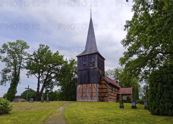 The Evangelical Lutheran St Peter's Church, the village church of Stuer in the Mecklenburg Lake District, is a half-timbered church with a half-timbered tower that is boarded up above the gabled roof of the nave. Stuer, Mecklenburg-Western Pomerania, Germany