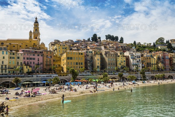 Town with colourful houses by the sea, Plage des Sablettes, Menton, Alpes Maritimes, Provence Alpes Cote d'Azur, French Riviera, South of France, France