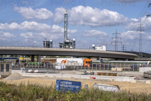 Motorway construction site at the Leverkusen-West junction, A1 and A59 motorways, new construction, reconstruction of the motorway junction due to the construction of the new Leverkusen Rhine bridge, construction period until the end of 2027, in the background, the Bürrig waste incineration plant, Leverkusen waste disposal centre, North Rhine-Westphalia, Germany