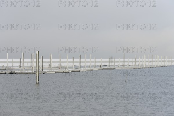 Winter day, onset of winter, snow on the jetties in the marina, North Sea, Norddeich, Lower Saxony, Germany