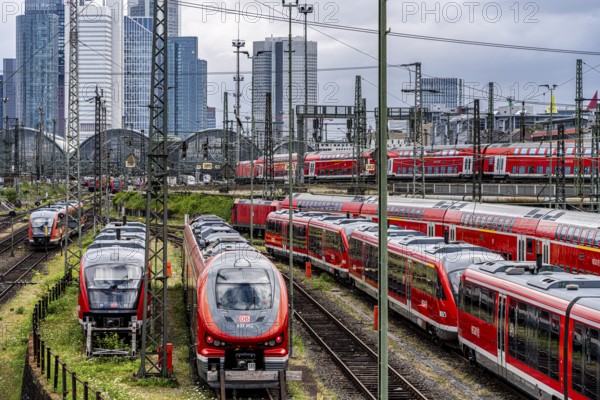 Bridge at Camberger Straße, Galluswarte, Deutsche Bahn, tracks and trains with the skyline of Frankfurt am Main, Hesse, Germany