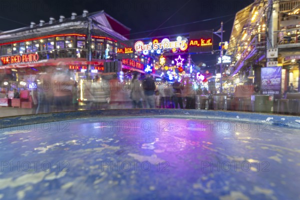 Neon lights, the legendary restaurant THE RED PIANO, Pub Street in the evening, entertainment district with bars and restaurants, Siem Reap, Cambodia