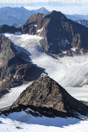 At the Wilder Freiger summit, picturesque high mountain landscape with snow, view of the Übeltalferner glacier and rocky mountain peaks Becher with Becherhaus and Königshofspitz, Stubai Alps, South Tyrol, Italy