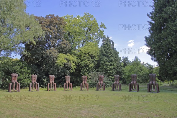 Sculpture Seated Figures by Magdalena Abakanowicz 2010, art installation, modern art, abstract art, steel sculpture, rusty, row of chairs, chairs, row, series, circle, 9 seated figures, torso, without, none, none, missing, head, synchronous, Gustavsgarten, Bad Homburg, Taunus, Hesse, Germany