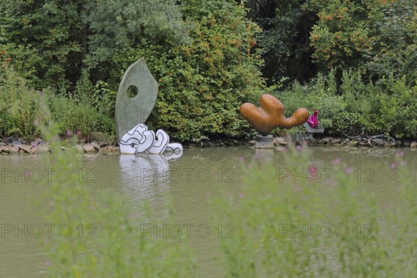 Art installation The Year of Living Dangerously by Maria Loboda 2022, Blickachsen 14, sculpture, modern art, abstract art, lakeside, bank, pond, spa gardens, Bad Homburg, Taunus, Hesse, Germany
