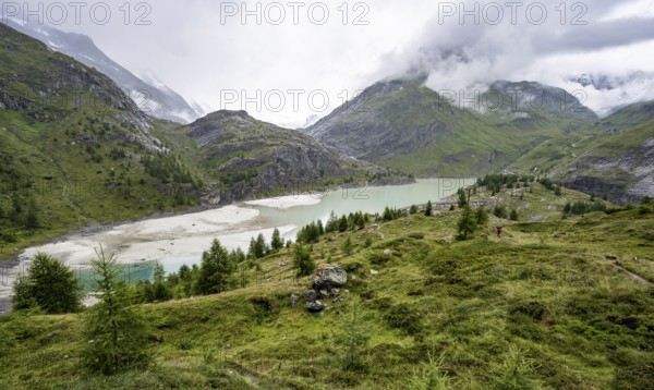 Cloudy mountain landscape, reservoir Speicher Margaritzen, Großglockner High Alpine Road, Hohe Tauern National Park, Carinthia, Austria