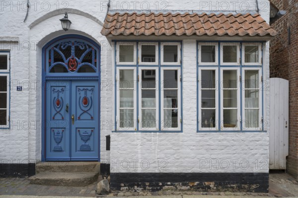 Beautiful ornate door mullion window, facade, old town, Husum, North Frisia, Schleswig-Holstein, Germany