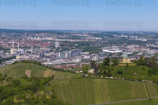 Panoramic view over Stuttgart with vineyards in the foreground and urban skyline behind, view of the burial chapel of Stuttgart-Rotenberg, in the background the Mercedes-Benz plant in Stuttgart-Untertürkheim and the MHP Arena, Baden-Württemberg, Germany