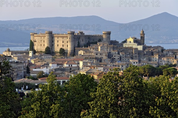 Castello Odescalchi fortress, Duomo Santo Stefano cathedral, behind Lake Bracciano, Lago di Bracciano, old town centre, Bracciano, metropolitan city of Rome, Lazio, Italy