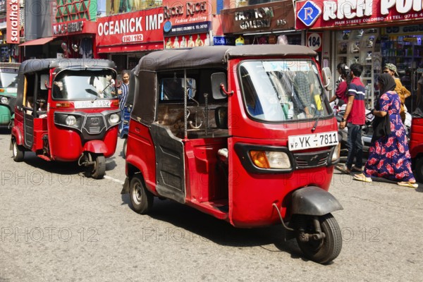 Motorized tuk tuk in a shopping street, Colombo, Sri Lanka