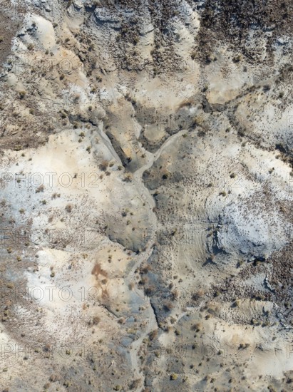 Broken, rocky ground with sparse vegetation. Aerial view. Drone shot. Southern Namibia