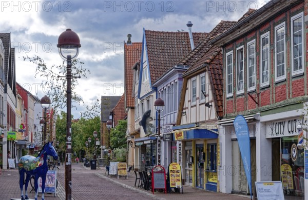 Buildings and shops in Lange Straße in the historic old town centre of Nienburg an der Weser. Nienburg, Lower Saxony, Germany