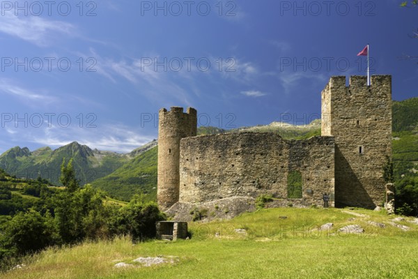 The ruins of the Château Sainte-Marie castle in Esterre and the mountain landscape near Luz-Saint-Sauveur, Pyrenees, France