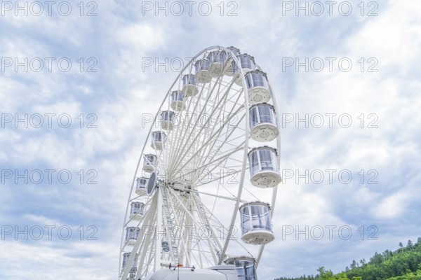 Ferris wheel in full height in front of a cloudy sky, Ferris wheel construction for the 950th anniversary of the city of Calw, Black Forest, Germany