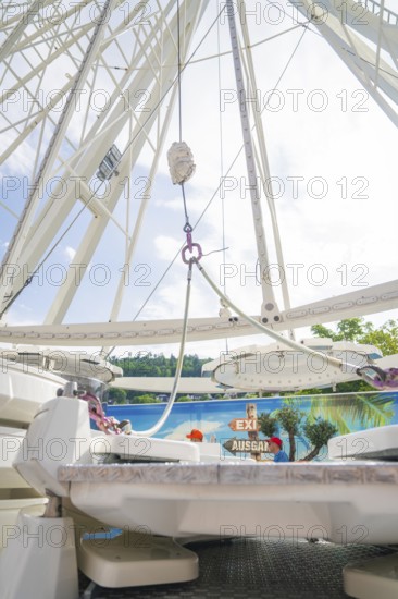 View from below of the structure of a Ferris wheel in front of a blue sky, Ferris wheel construction for the 950th anniversary of the town of Calw, Black Forest, Germany