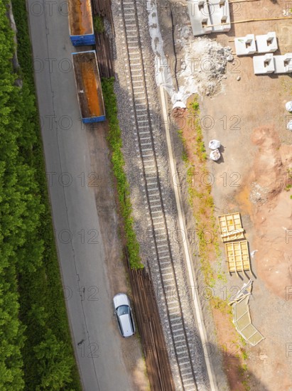 Aerial view of railway tracks and construction work, with a passing car, construction of the Hermann Hesse railway, Calw, Germany