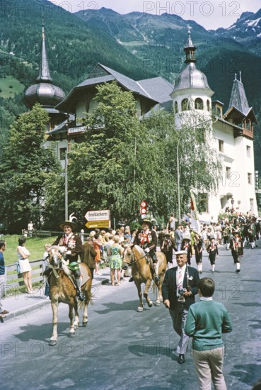 People in street procession through village of Oetz, Imst district, Tyrol, Austria, Europe, 1970