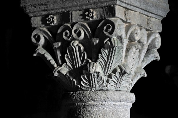 Column capitals with plants, flora, relief in stone, underground grove of columns, pagan crypt, 10th century, gloomy illumination, Cathedral of Acquapendente, Basilica of the Holy Sepulchre, Basilica Santo Sepolcro, Basilica minor, Aquapendente, Province of Viterbo, Lazio, Italy