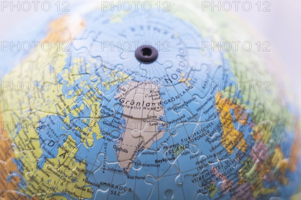 Puzzle globe. Map made from puzzle pieces. Greenland and Denmark