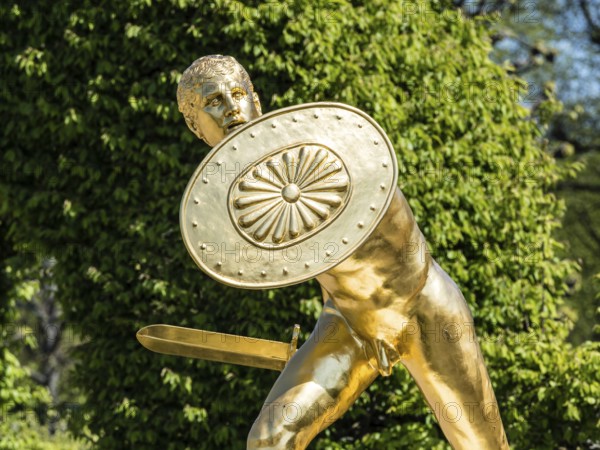 Golden sculpture, warrior with shield and sword, Herrenhausen Gardens, Baroque garden at castle Herrenhausen, Herrenhäuser Gärten, Hanover, Germany