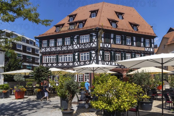 Town view of Nagold in the northern Black Forest. Half-timbered house Hotel Post on the suburban square. Nagold, Baden-Württemberg, Germany