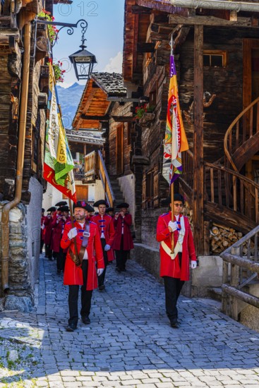 Pipers and drummers accompany the Corpus Christi procession, historic town centre, Grimentz, Val d'Anniviers, Valais Alps, Canton Valais, Switzerland