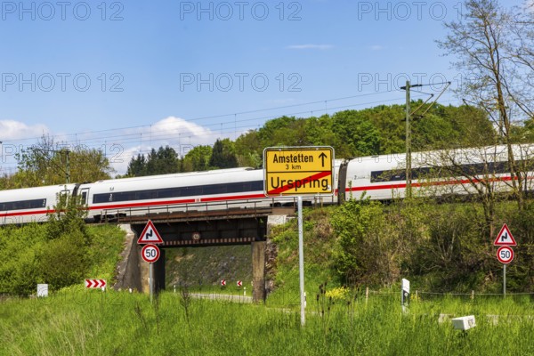 InterCityExpress ICE en route on the Swabian Alb near Lonsee. Landscape with railway bridge near Urspring on the Filstalline railway line in spring. Lonsee, Baden-Württemberg, Germany