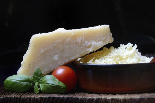 Parmesan cheese, grated cheese in rind and piece of Parmesan, Italy