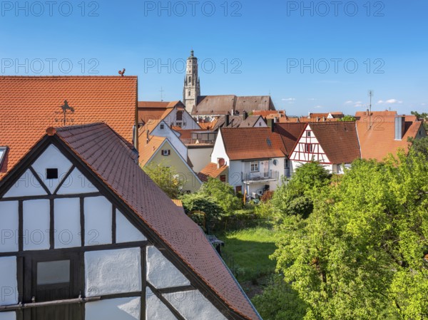 View from the medieval town wall over the houses of the historic old town to the tower of St George's Church, called Daniel, Nördlingen, Bavaria, Germany